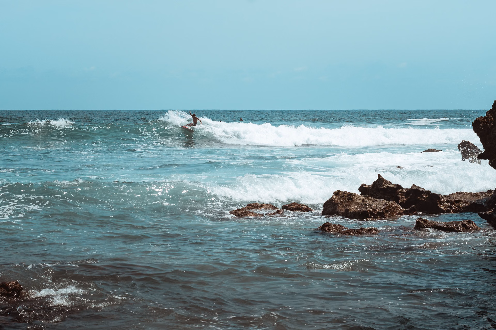 Surfer riding a wave at a coastal break, La Jolla lifestyle, Costa Azul, San José del Cabo