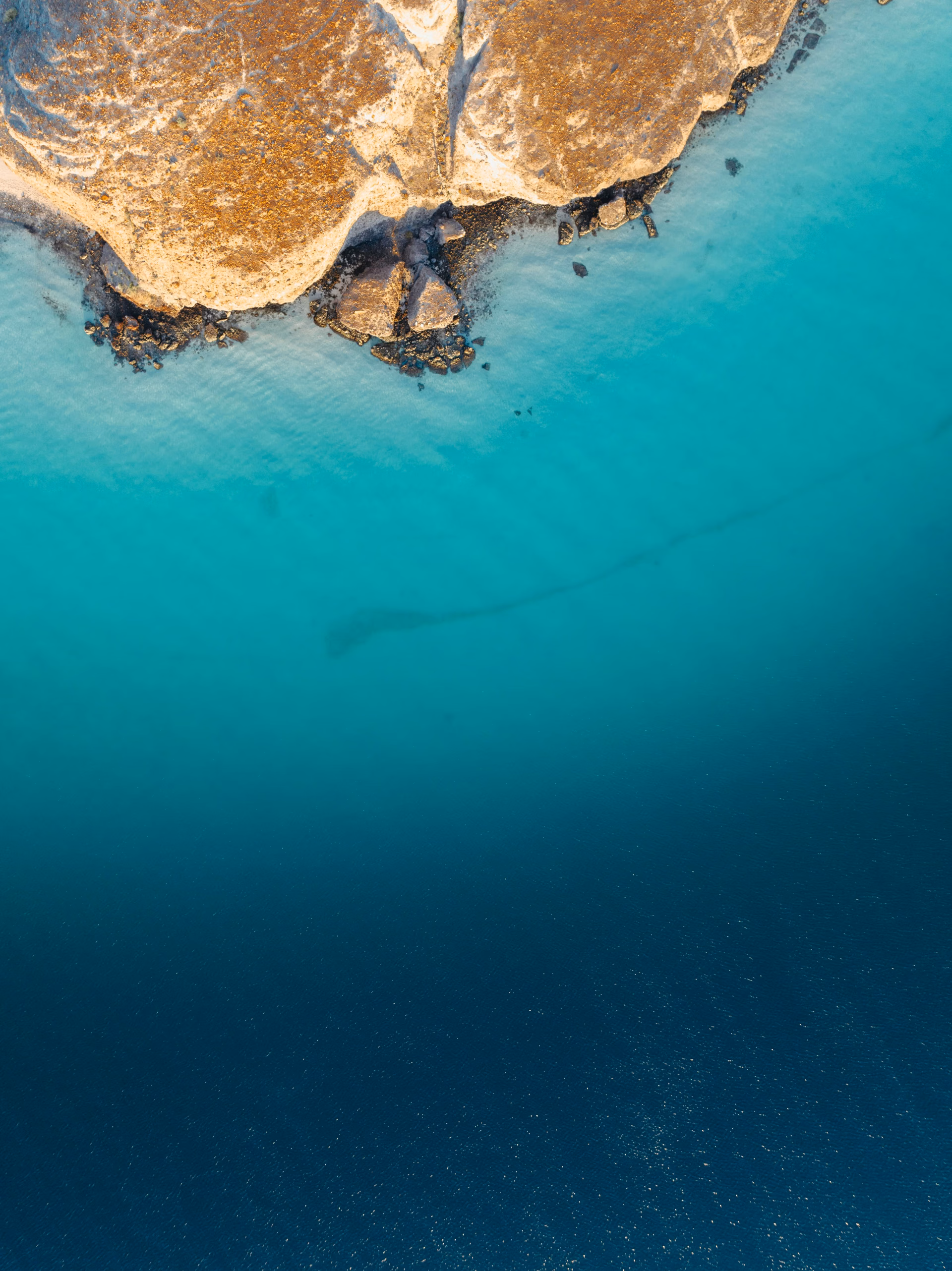 Aerial drone view of a pristine Baja California Sur beach with turquoise water, Mexico